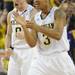 Michigan senior Zack Novak and freshman Trey Burke celebrate a play in the second half against Northwestern at Crisler Center on Wedensday. Melanie Maxwell I AnnArbor.com